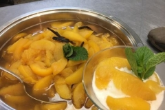 Bourbon Pouched Peaches served with vanilla ice cream