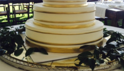 wedding cake with gold stripes