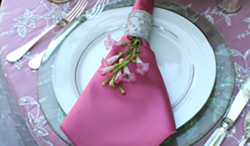 pink napkin on white plate