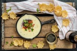 queso dip in cast iron pan