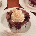 vanilla ice cream on top of mixed berry cobbler