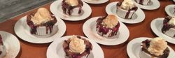 mixed berry cobbler topped with vanilla ice cream