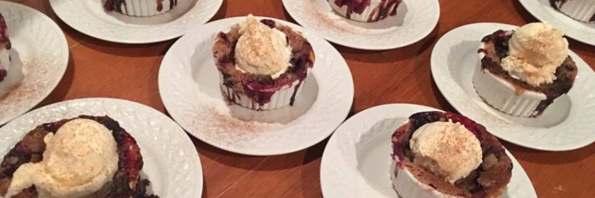 berry cobbler with ice cream on top