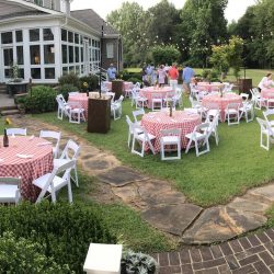 tables covered in red checkered table clothes for outdoor event