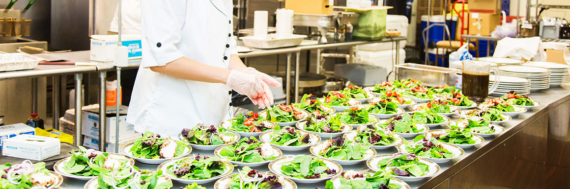 caterer preparing salad