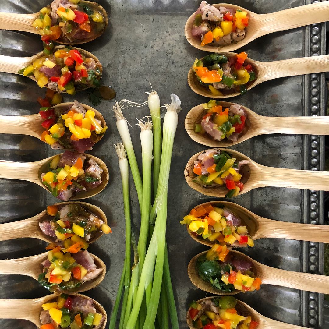 wooden spoons filled with chunky homemade salsa