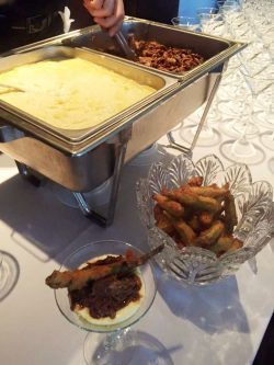 creamy stone ground grits with braised beef and crispy fried okra
