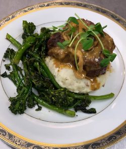 Petit Filet with Wild Mushroom Demi-Glace, Creamy Mashed Potatoes, Roasted Broccolini, with a Local Microgreen Garnish