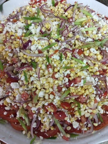 Fresh Corn, Heirloom Tomato, Pickled Onion, and Cotija Cheese Salad