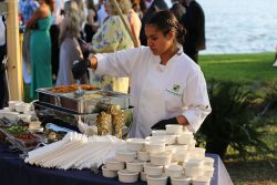 Scarborough Fare Catering team serving food a eastern NC wedding