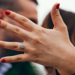 Woman with engagement ring with fiance