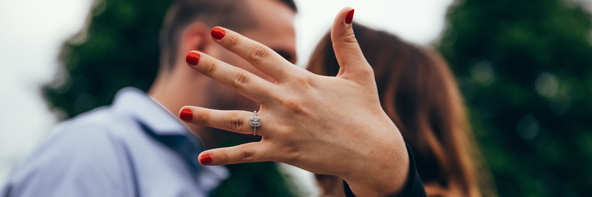 Woman with engagement ring with fiance